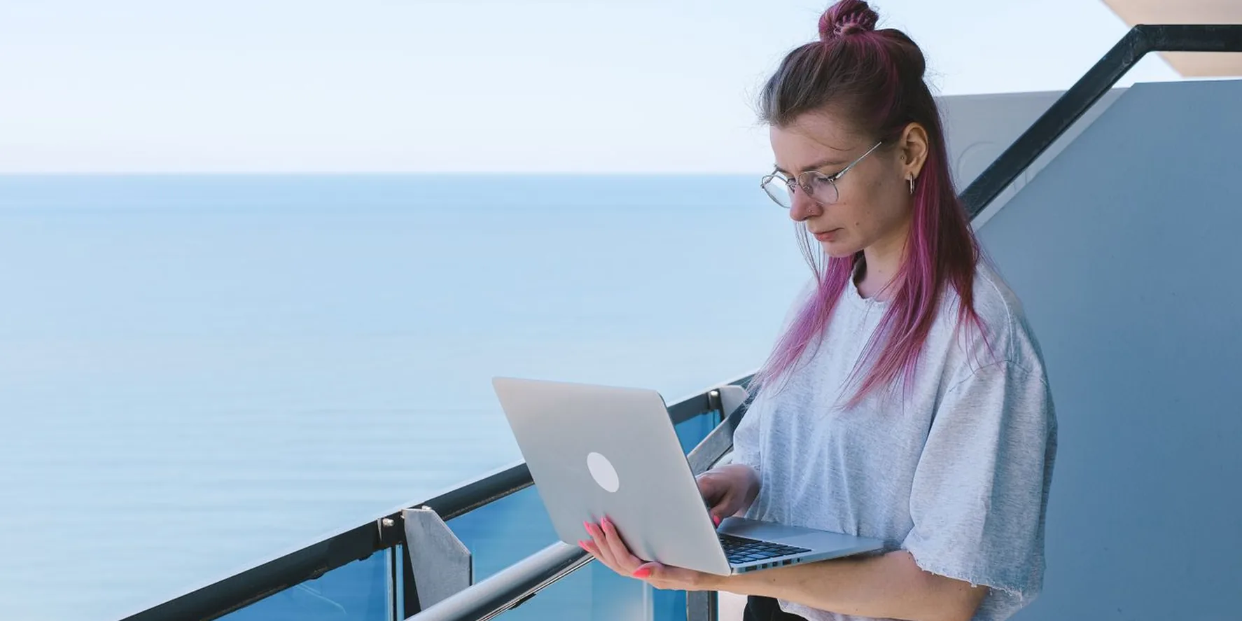 Working remotely from a balcony with an ocean view