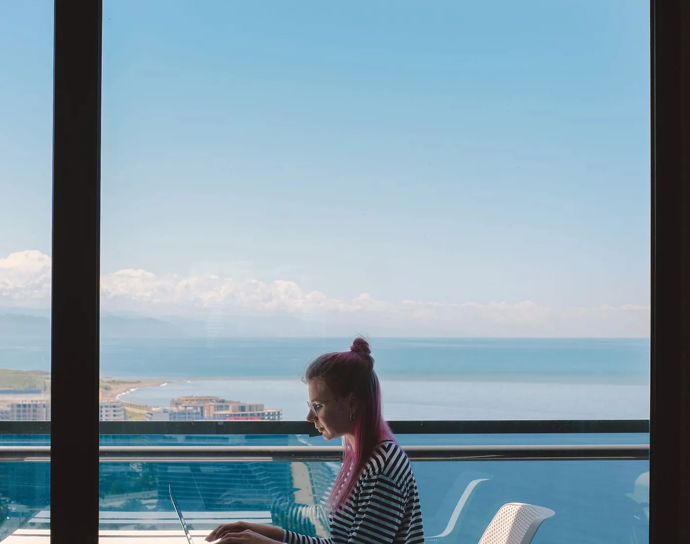 Professional working remotely on a laptop